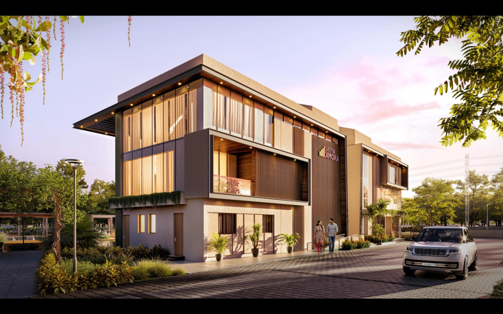Clubhouse exterior at Sattva Amora with warm evening lighting